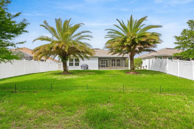 view of yard featuring a sunroom