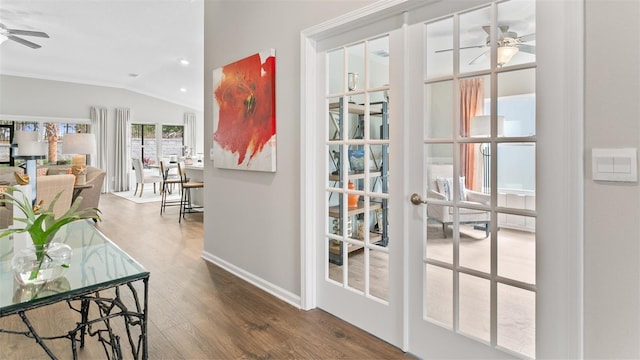 entryway with vaulted ceiling, french doors, baseboards, ceiling fan, and wood finished floors