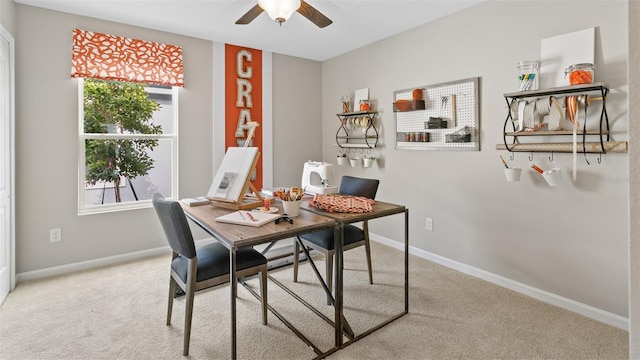 carpeted dining area featuring baseboards, a healthy amount of sunlight, and ceiling fan