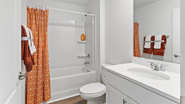 full bathroom featuring toilet, wood finished floors, vanity, and shower / bathtub combination with curtain