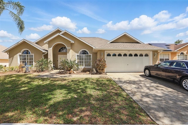 1956 Southern Dunes Blvd, Haines City, FL 33844 - single story home with an attached garage, stucco siding, a front yard, and concrete driveway