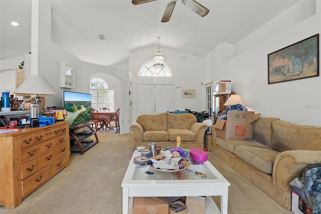 1956 Southern Dunes Blvd, Haines City, FL 33844 - living area featuring light colored carpet, vaulted ceiling, a ceiling fan, and arched walkways
