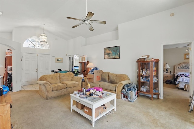 1956 Southern Dunes Blvd, Haines City, FL 33844 - living area featuring carpet, arched walkways, a ceiling fan, and high vaulted ceiling