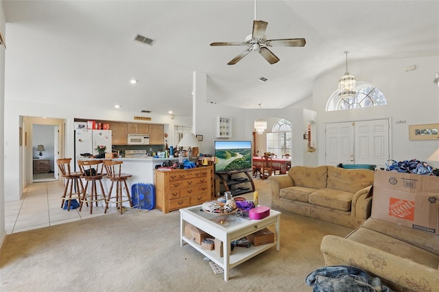 1956 Southern Dunes Blvd, Haines City, FL 33844 - living area with a chandelier, light tile patterned floors, ceiling fan, light carpet, and vaulted ceiling