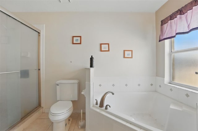 1956 Southern Dunes Blvd, Haines City, FL 33844 - bathroom with a bath, toilet, a shower stall, and tile patterned flooring