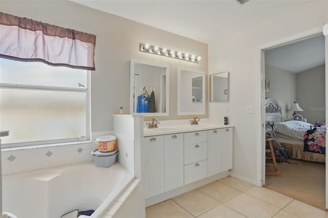 1956 Southern Dunes Blvd, Haines City, FL 33844 - bathroom with tile patterned floors, a garden tub, connected bathroom, and double vanity