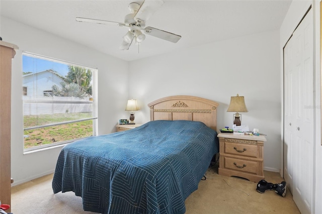 1956 Southern Dunes Blvd, Haines City, FL 33844 - bedroom with light carpet, baseboards, a closet, and a ceiling fan