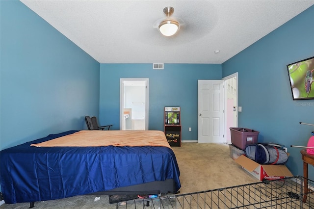 1305 Rebecca Dr, Haines City, FL 33844 - carpeted bedroom featuring ensuite bath and a textured ceiling