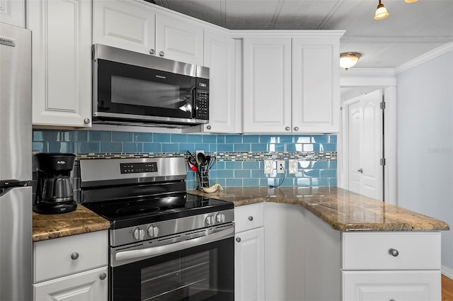 151 Lookout Dr, Flagler Beach, FL 32136 - kitchen with appliances with stainless steel finishes, backsplash, white cabinets, and crown molding