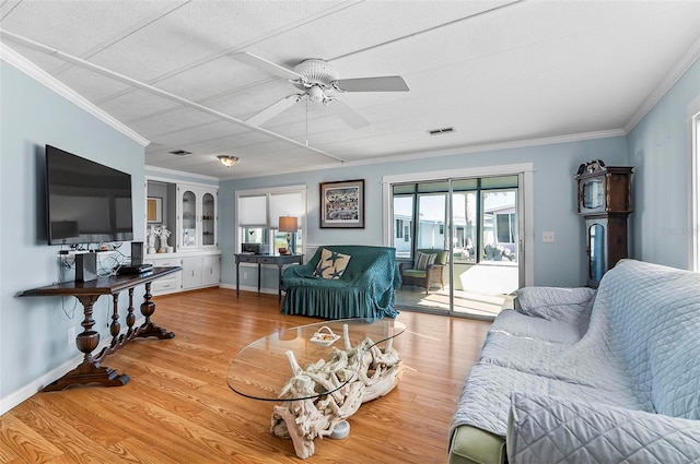 151 Lookout Dr, Flagler Beach, FL 32136 - living room with crown molding, a ceiling fan, wood finished floors, and baseboards