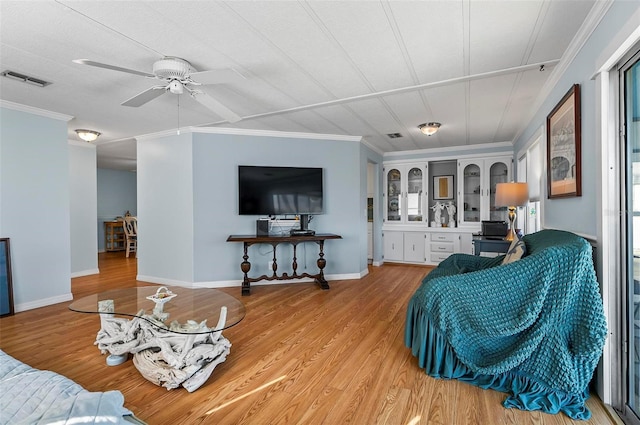 151 Lookout Dr, Flagler Beach, FL 32136 - living room featuring crown molding, a ceiling fan, light wood-type flooring, and baseboards