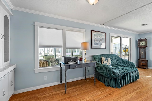 151 Lookout Dr, Flagler Beach, FL 32136 - sitting room featuring plenty of natural light, wood finished floors, crown molding, and an office area