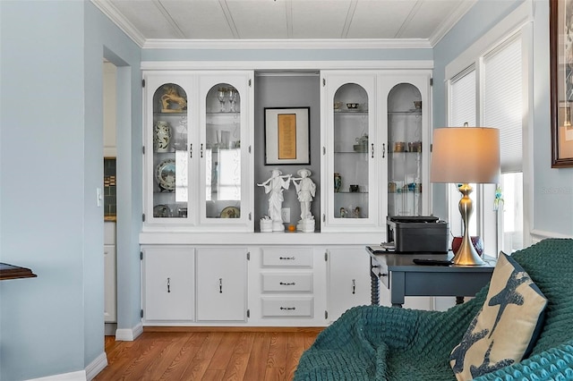151 Lookout Dr, Flagler Beach, FL 32136 - bar featuring light wood-style floors and ornamental molding