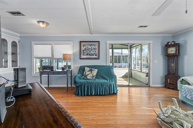 151 Lookout Dr, Flagler Beach, FL 32136 - sitting room featuring light wood-style flooring, plenty of natural light, crown molding, a ceiling fan, and baseboards