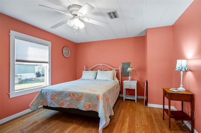 151 Lookout Dr, Flagler Beach, FL 32136 - bedroom with wood finished floors, baseboards, and a ceiling fan