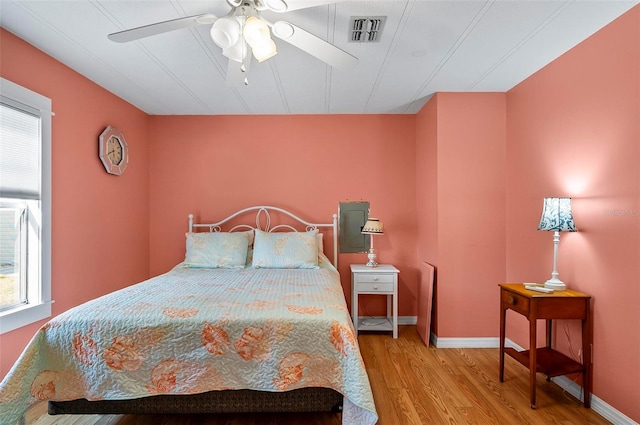 151 Lookout Dr, Flagler Beach, FL 32136 - bedroom featuring wood finished floors, a ceiling fan, and baseboards