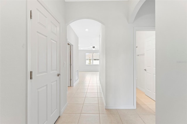 3 Oakleaf Way, Palm Coast, FL 32137 - hall with arched walkways, light tile patterned floors, and baseboards