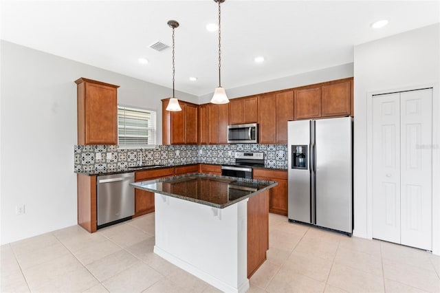 3 Oakleaf Way, Palm Coast, FL 32137 - kitchen with stainless steel appliances, a sink, brown cabinets, backsplash, and recessed lighting