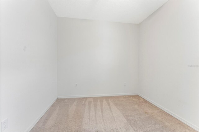 3 Oakleaf Way, Palm Coast, FL 32137 - empty room with light colored carpet and baseboards