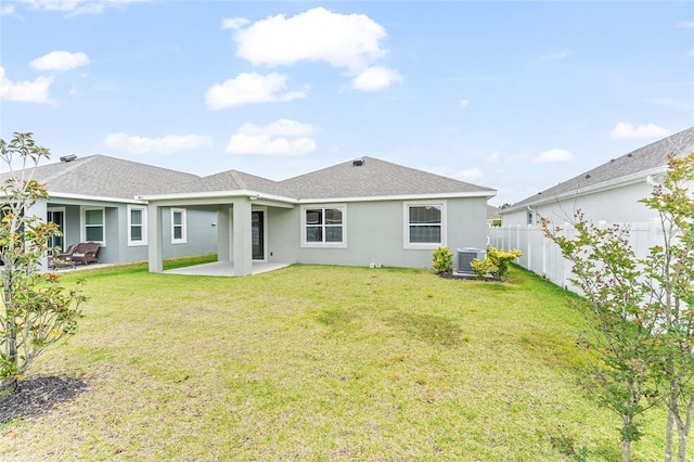 3 Oakleaf Way, Palm Coast, FL 32137 - back of house with stucco siding, central AC unit, a patio area, and a shingled roof