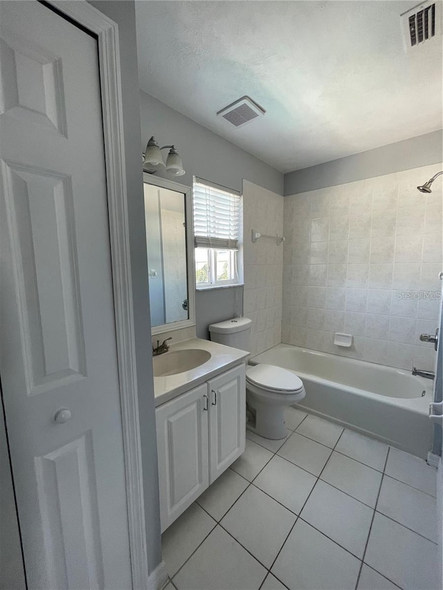 full bath featuring tile patterned flooring, toilet, shower / bathtub combination, and vanity