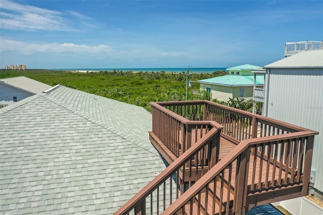 deck with a water view and stairway