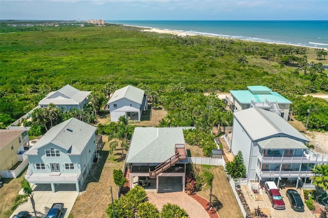 aerial view of residential area featuring waterfront with a beach