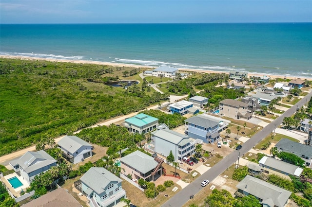 aerial view of residential area featuring expansive coastline