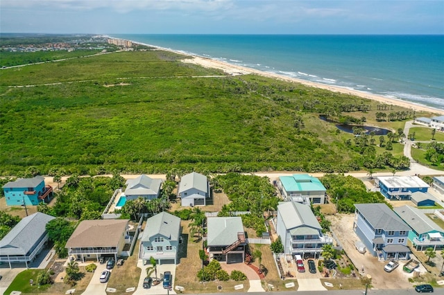 aerial view of residential area with expansive beach