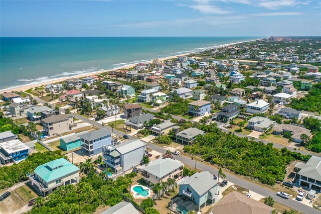 aerial view of residential area with waterfront with a beach
