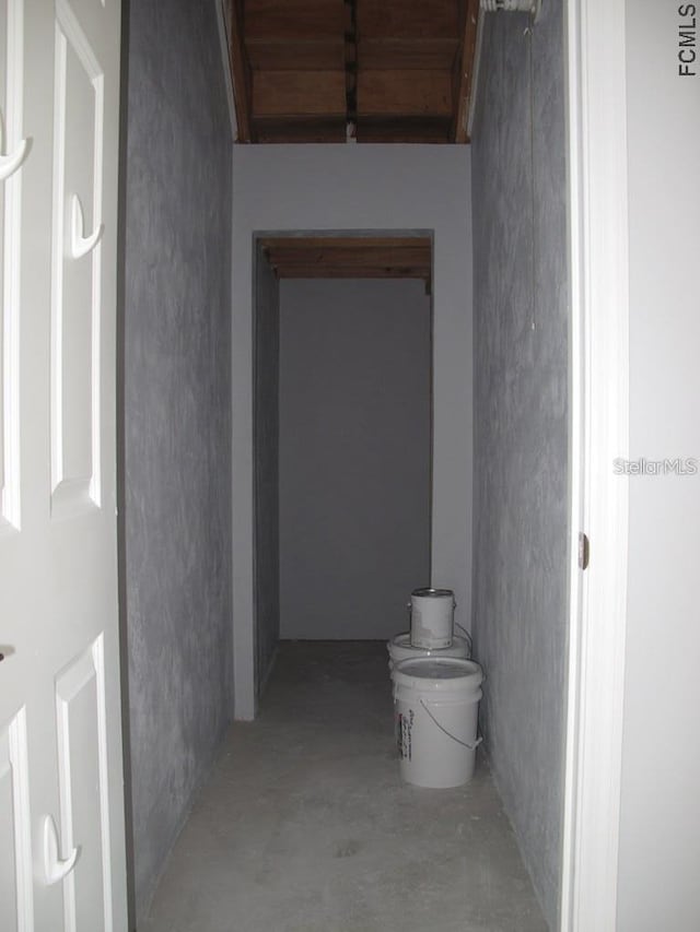 hall featuring concrete floors