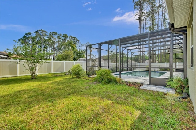 view of yard featuring glass enclosure