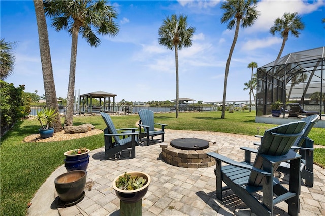 440 Lambert Ave, Flagler Beach, FL 32136 - view of patio / terrace with a fire pit, a gazebo, and glass enclosure