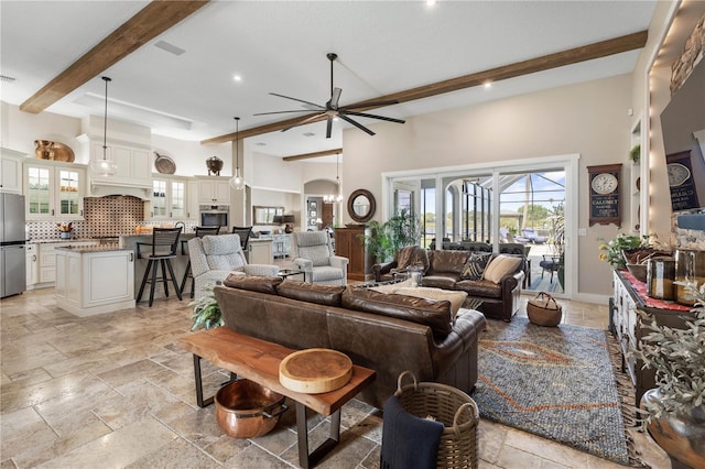440 Lambert Ave, Flagler Beach, FL 32136 - living area featuring stone tile floors, beamed ceiling, ceiling fan, healthy amount of natural light, and recessed lighting