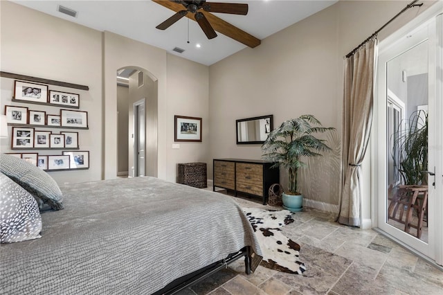 440 Lambert Ave, Flagler Beach, FL 32136 - bedroom with arched walkways, stone tile flooring, baseboards, recessed lighting, and ceiling fan