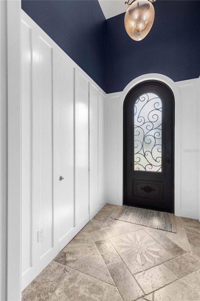 440 Lambert Ave, Flagler Beach, FL 32136 - foyer with stone finish floors and arched walkways
