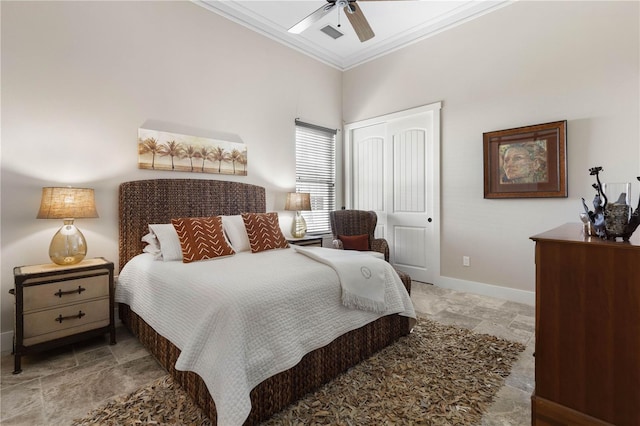 440 Lambert Ave, Flagler Beach, FL 32136 - bedroom featuring stone tile flooring, ornamental molding, a closet, baseboards, and ceiling fan