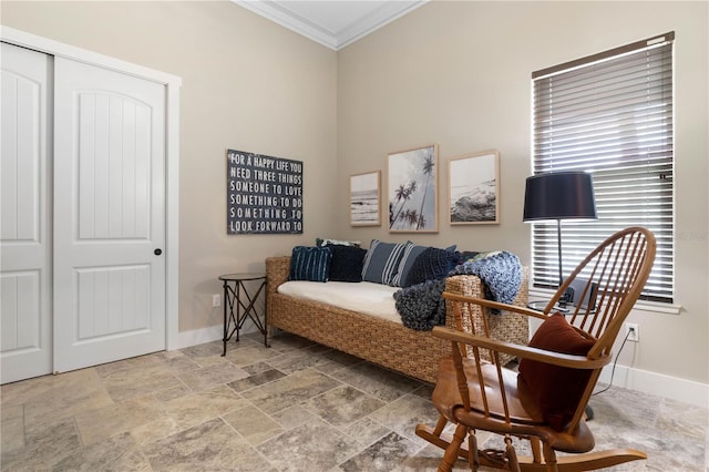 440 Lambert Ave, Flagler Beach, FL 32136 - living area with crown molding, baseboards, and stone tile flooring
