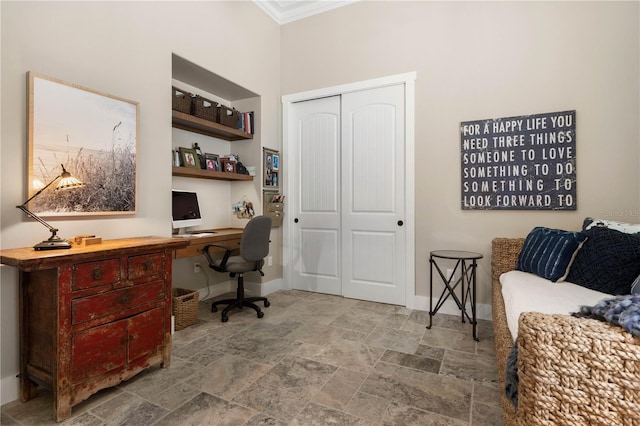 440 Lambert Ave, Flagler Beach, FL 32136 - home office with stone finish floors, ornamental molding, baseboards, and built in desk