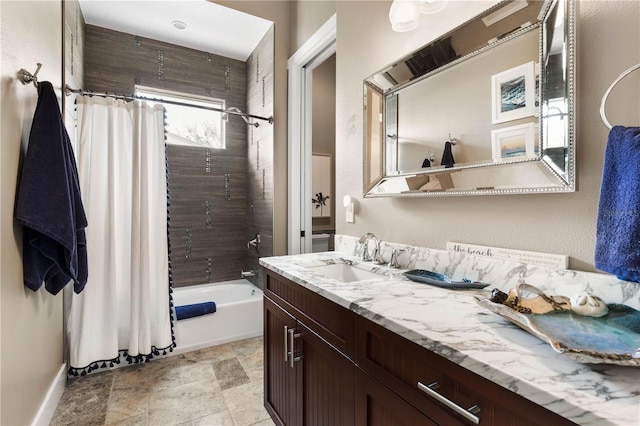 440 Lambert Ave, Flagler Beach, FL 32136 - bathroom featuring shower / bath combo with shower curtain, vanity, stone finish flooring, and baseboards