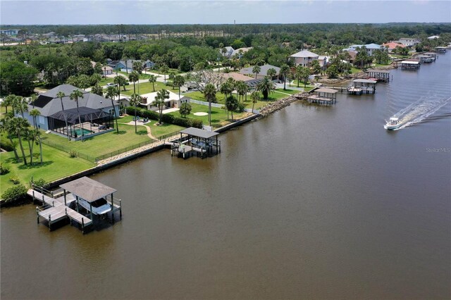 440 Lambert Ave, Flagler Beach, FL 32136 - aerial perspective of suburban area with a large body of water and a tree filled landscape