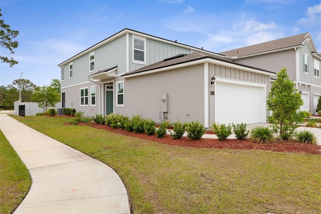 155 Redbud Rd, Palm Coast, FL 32137 - view of front of home with board and batten siding, central AC unit, a garage, and stucco siding