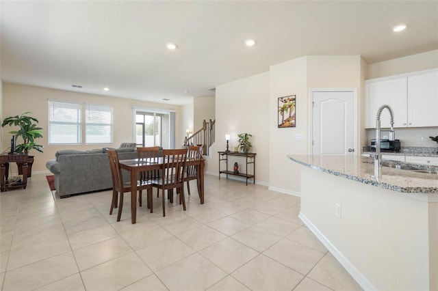155 Redbud Rd, Palm Coast, FL 32137 - dining room featuring recessed lighting, light tile patterned floors, baseboards, and stairs