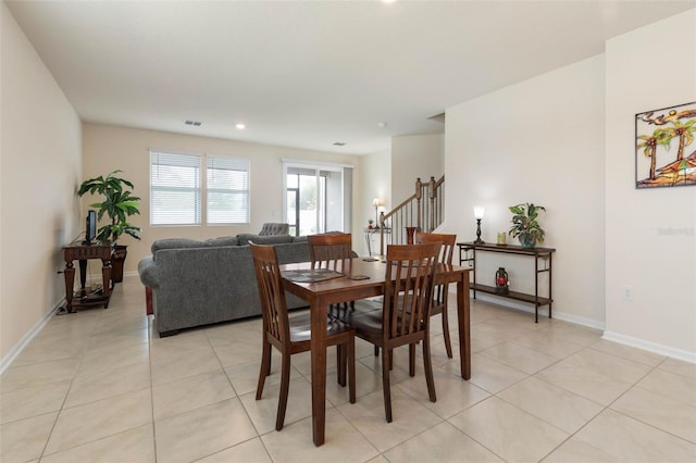 155 Redbud Rd, Palm Coast, FL 32137 - dining room with stairs, light tile patterned floors, baseboards, and recessed lighting