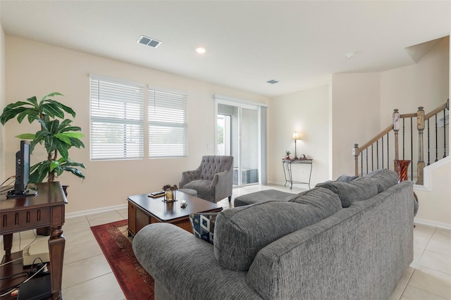 155 Redbud Rd, Palm Coast, FL 32137 - living area with stairway, light tile patterned floors, baseboards, and recessed lighting