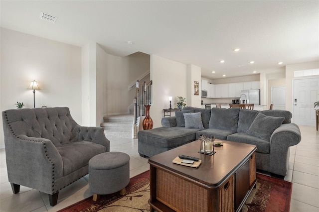 155 Redbud Rd, Palm Coast, FL 32137 - living area featuring stairs, light tile patterned flooring, and recessed lighting