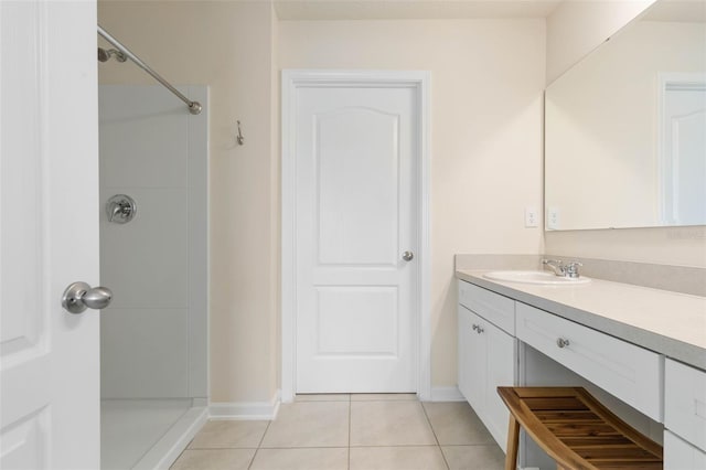 155 Redbud Rd, Palm Coast, FL 32137 - bathroom with tile patterned floors, a shower, vanity, and baseboards