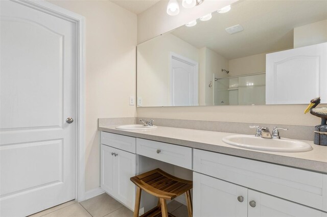 155 Redbud Rd, Palm Coast, FL 32137 - full bath with tile patterned floors, double vanity, and a shower
