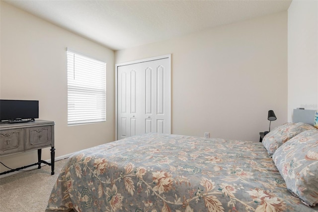 155 Redbud Rd, Palm Coast, FL 32137 - bedroom featuring carpet flooring, a closet, and baseboards