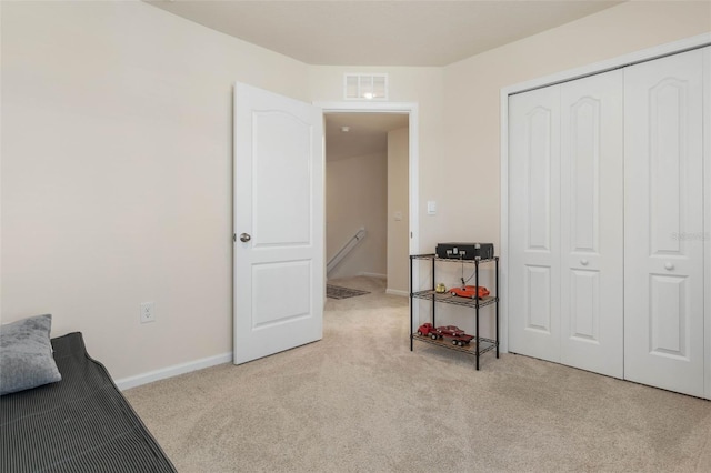 155 Redbud Rd, Palm Coast, FL 32137 - bedroom featuring carpet flooring, a closet, and baseboards